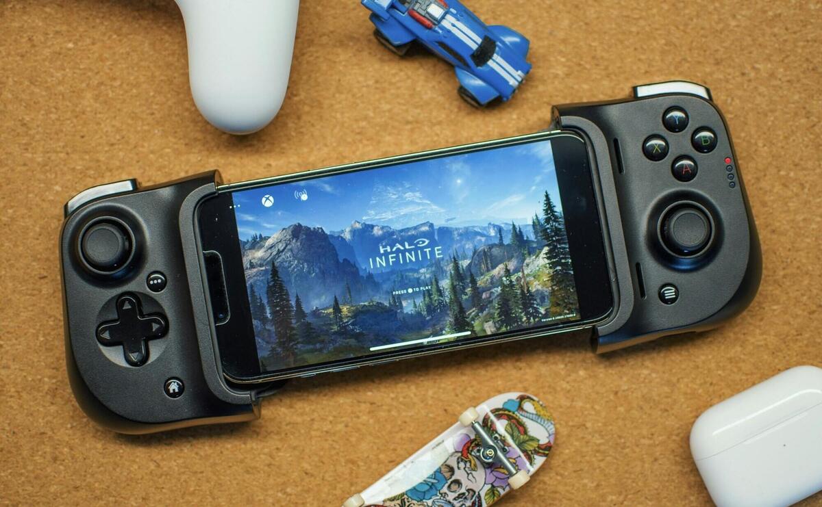 a game controller sitting next to a smart phone