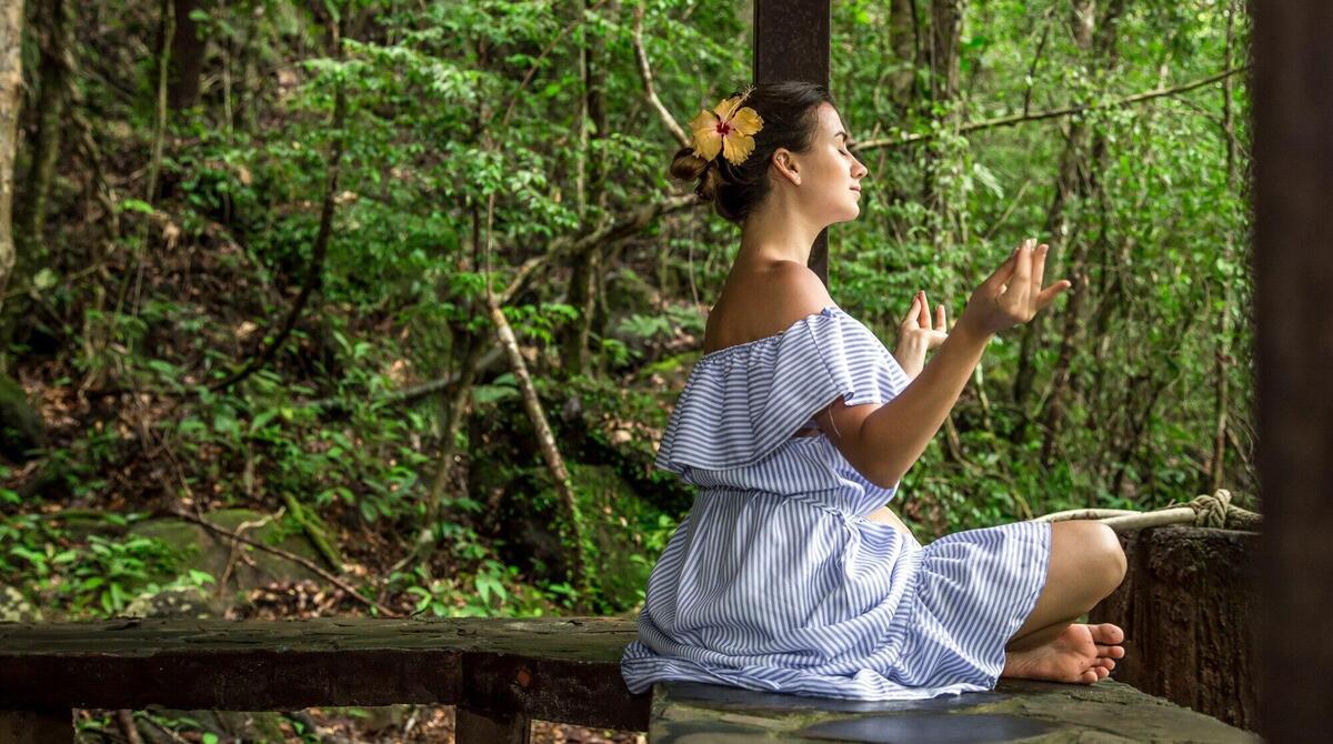 girl in a dress meditates