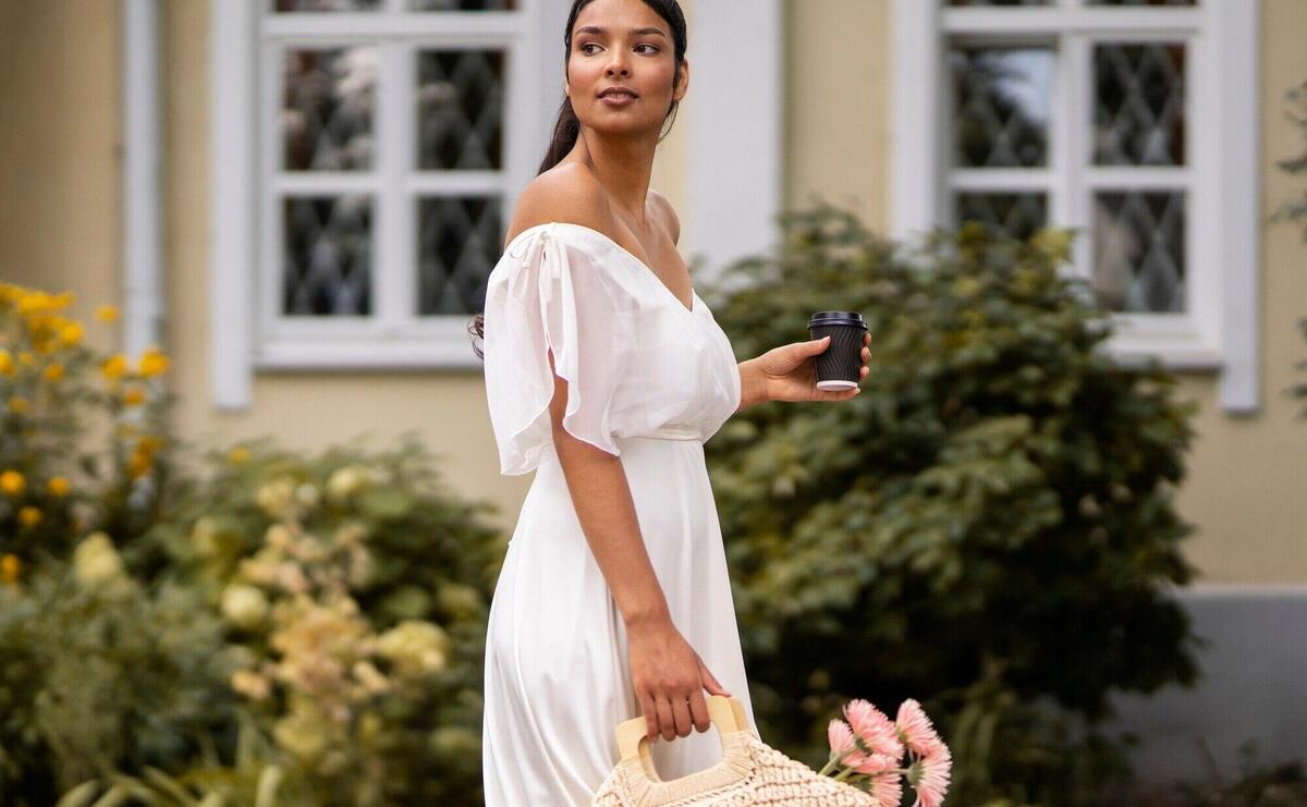 Side view indian woman carrying bag