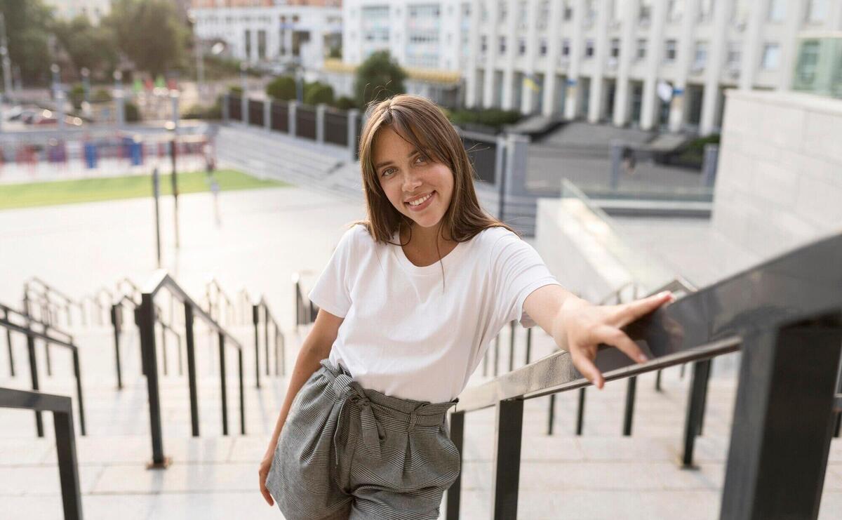 Portrait of a beautiful woman posing on stairs