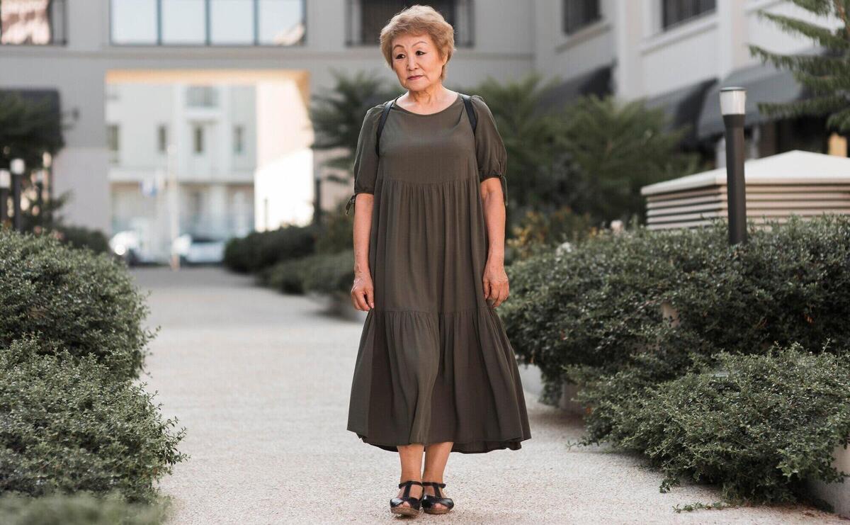 Full shot woman walking on alley