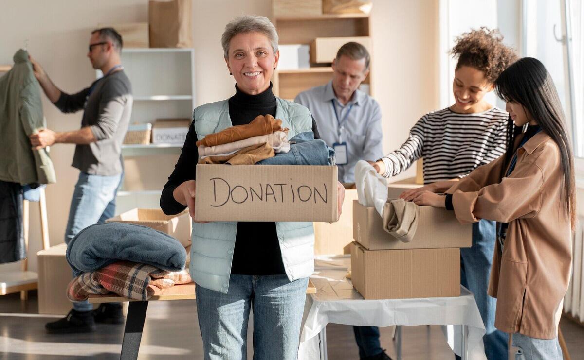 Medium shot volunteers with donations