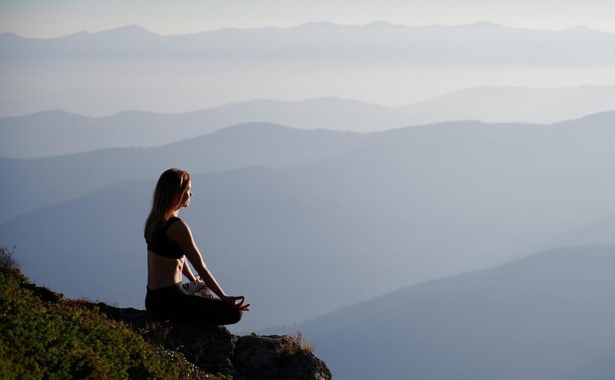 Woman relaxing and meditating on fresh air