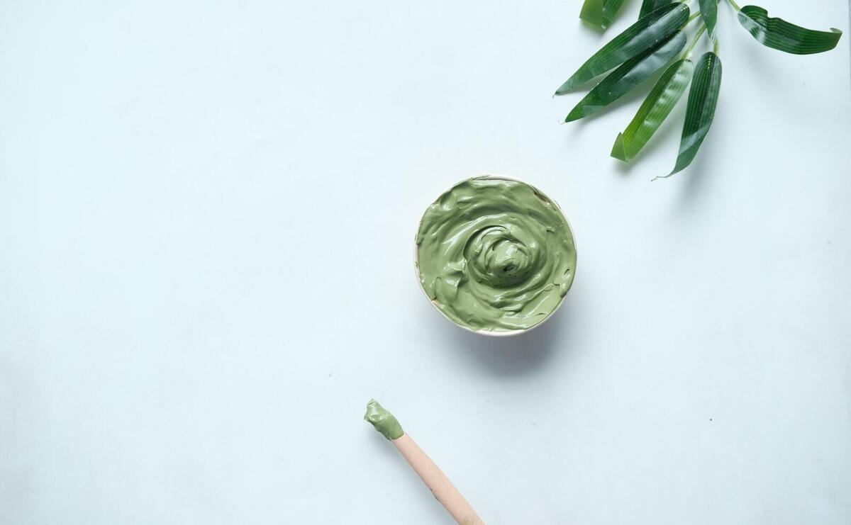 green ceramic round bowl on white table