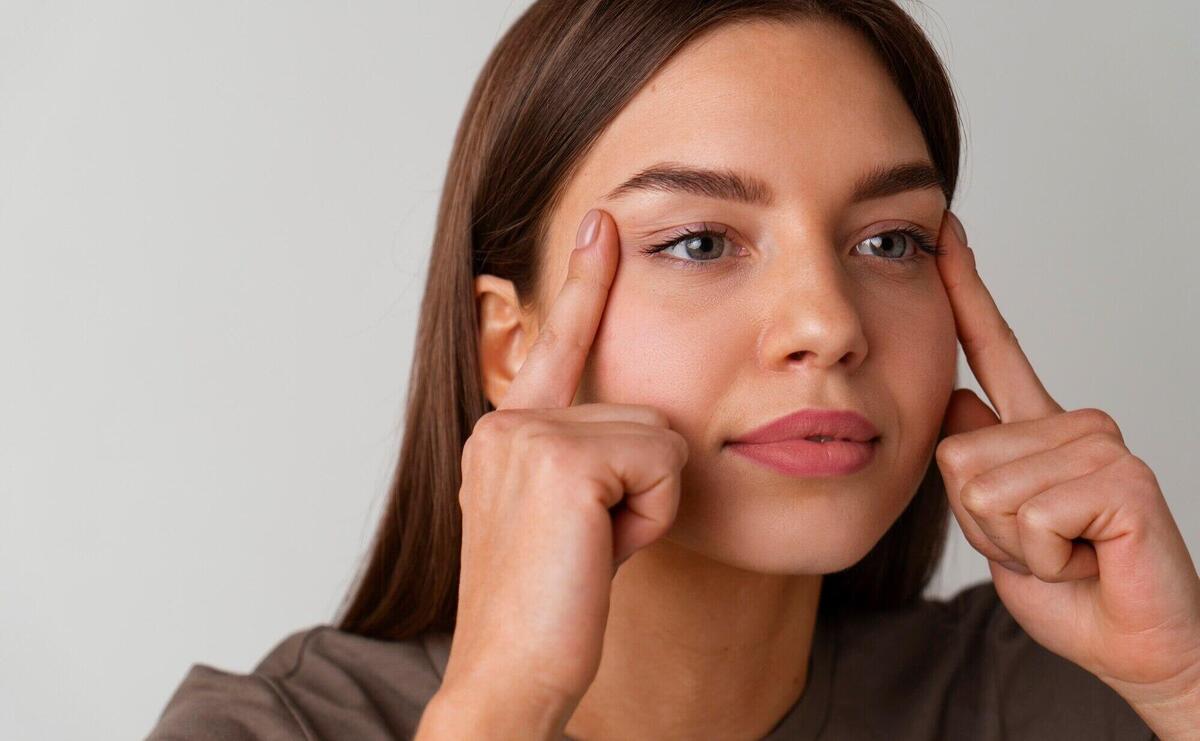 Front view woman practicing facial yoga