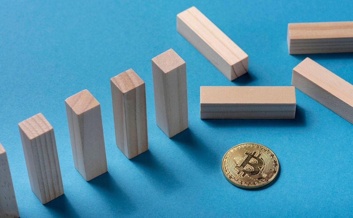 High angle of domino pieces with bitcoin