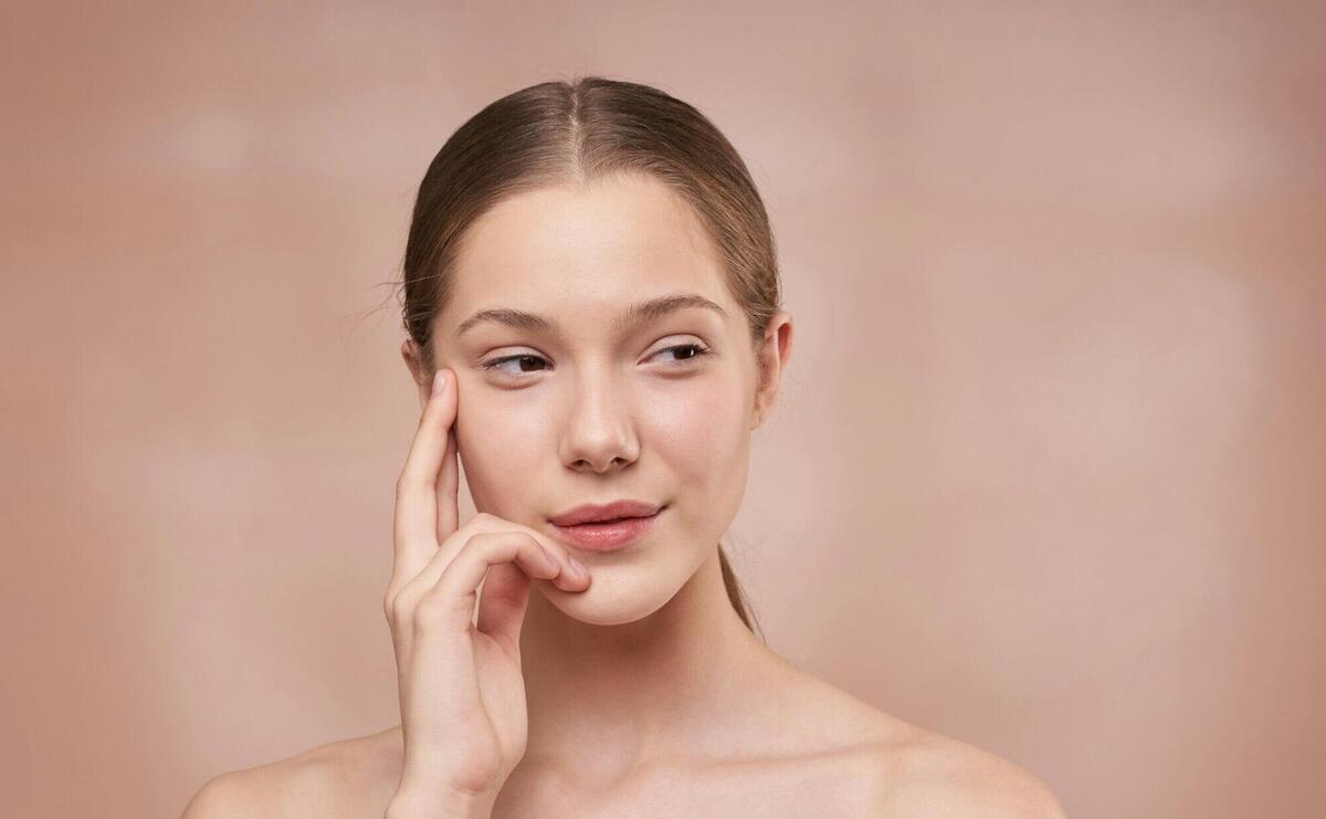 Woman Holding Her Face