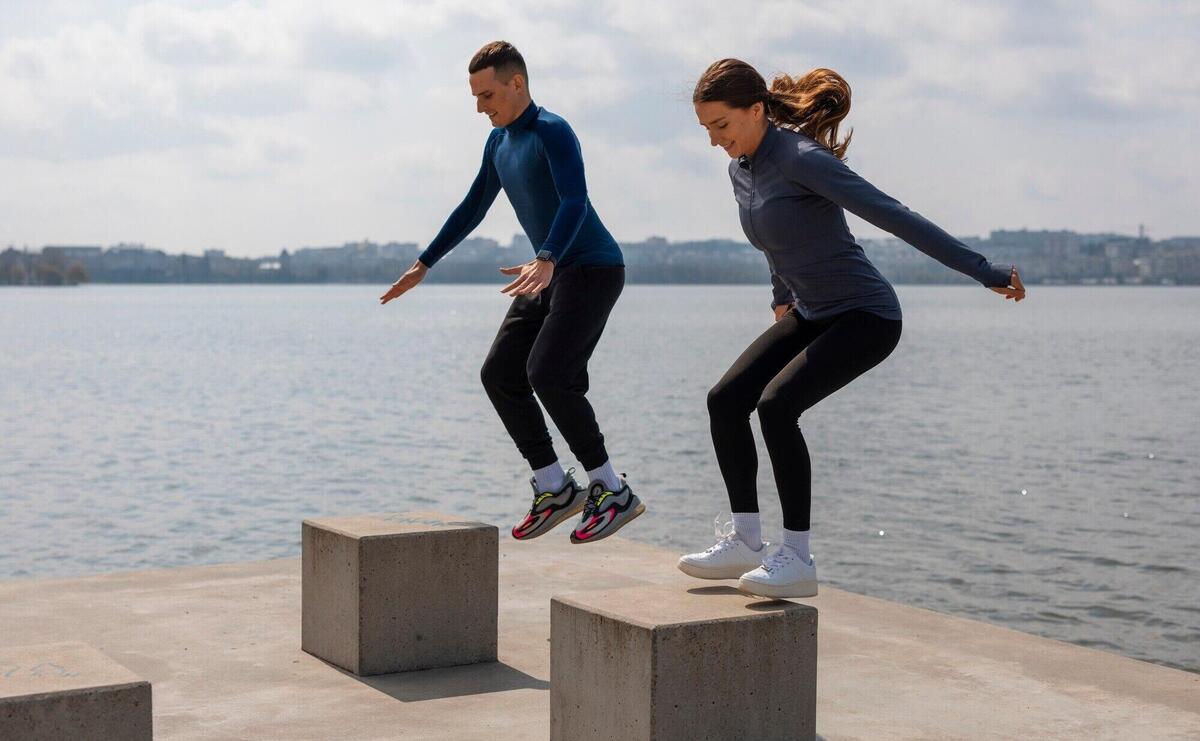 Full shot couple doing workout exercises