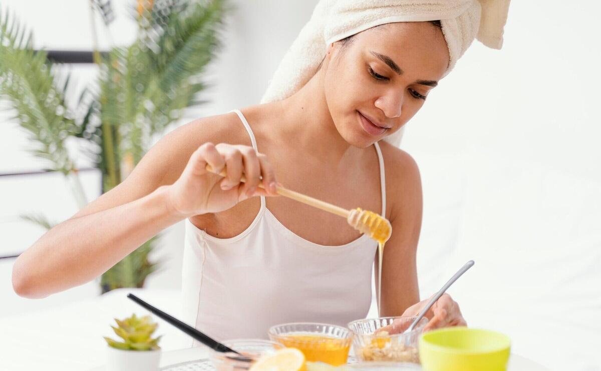 Young woman making a natural face mask at home