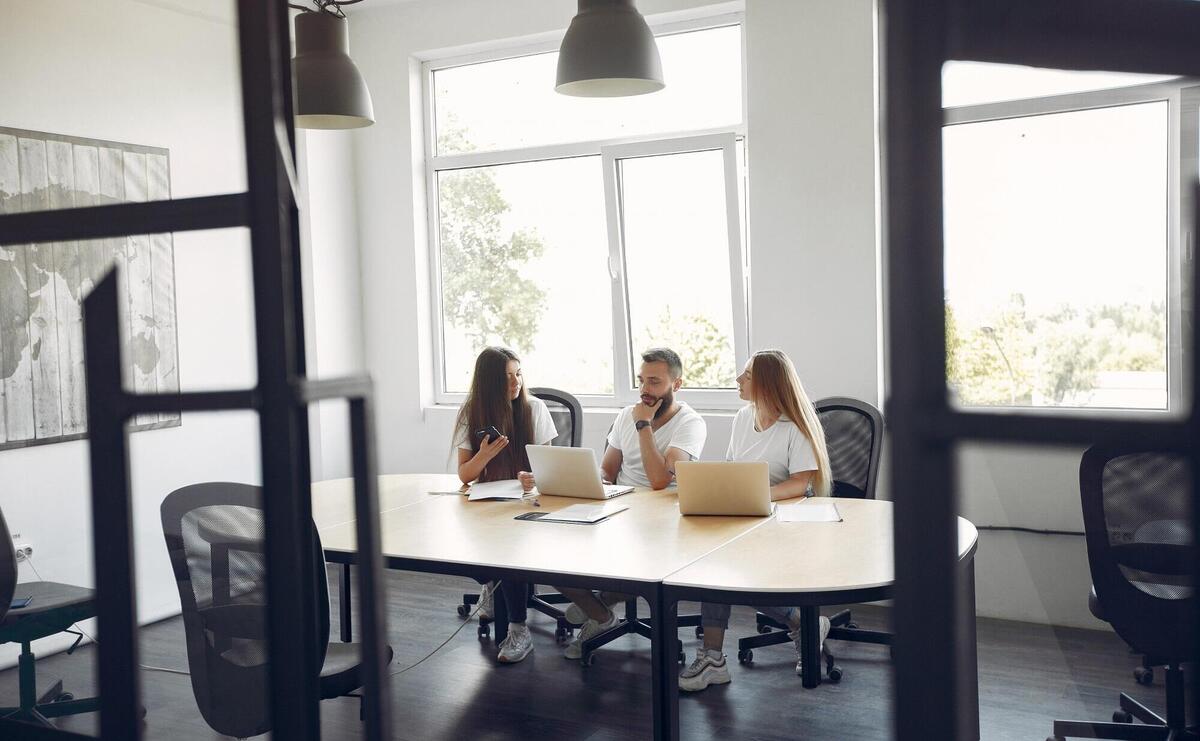 Young team working together and use the laptop