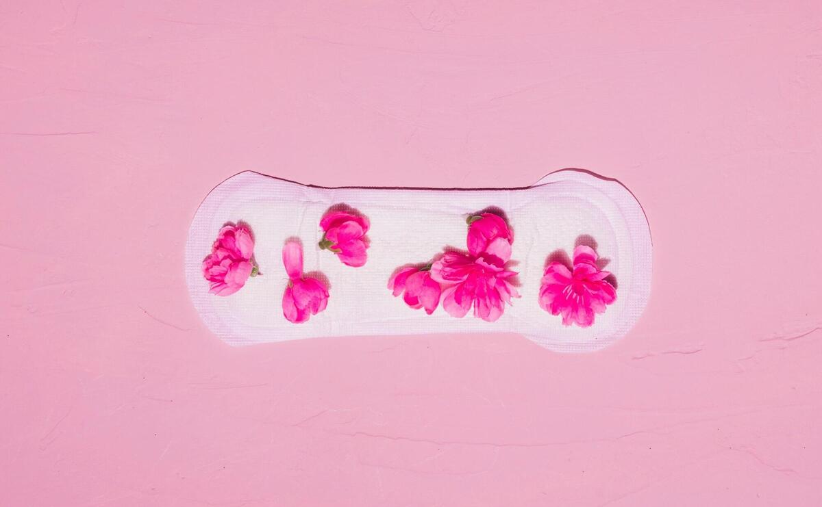 Top view sanitary towel with petals