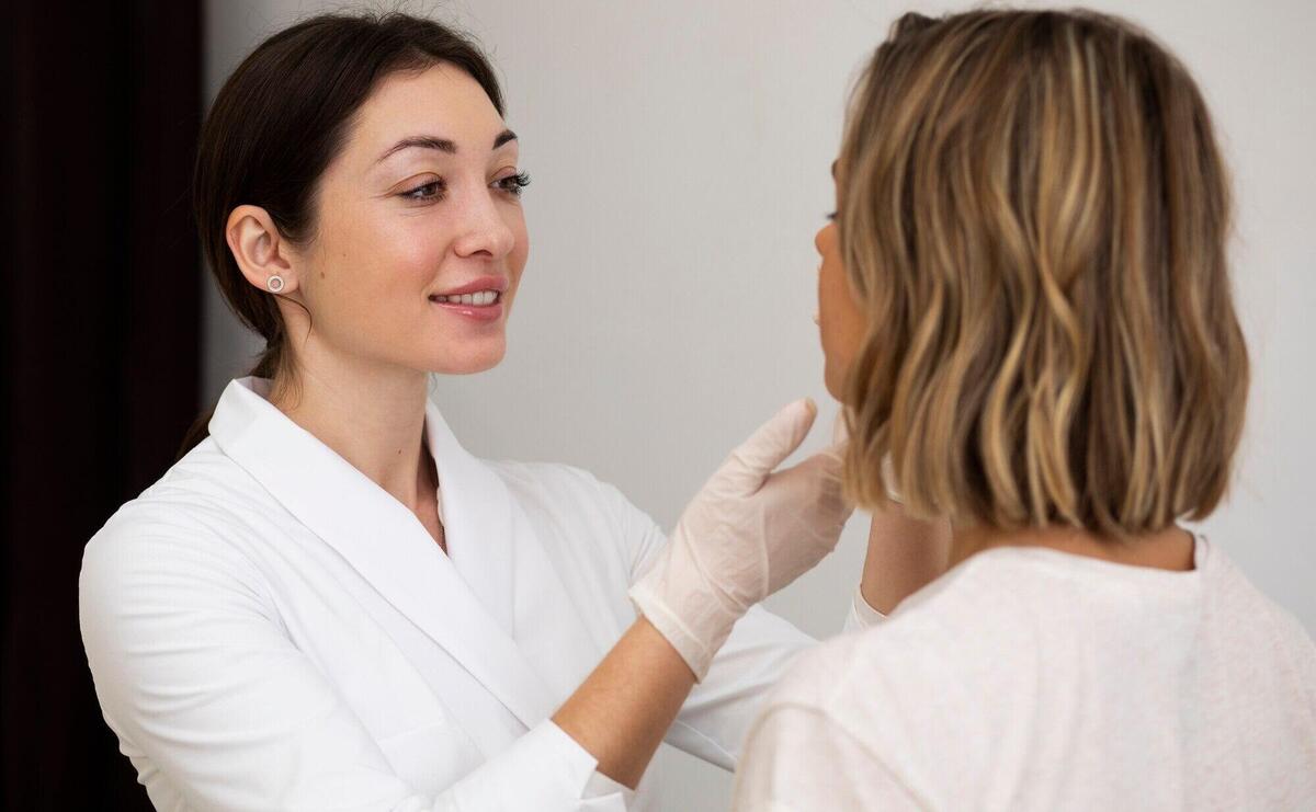 Medium shot woman at smiley doctor's appointment