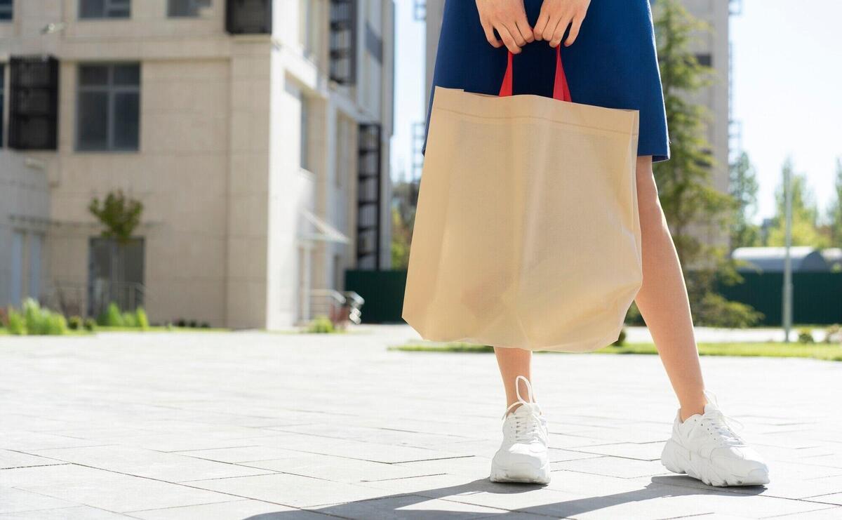 Woman shopping with fabric tote bag