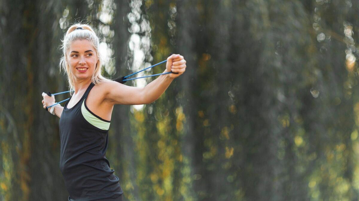 Portrait of woman stretching with copy space